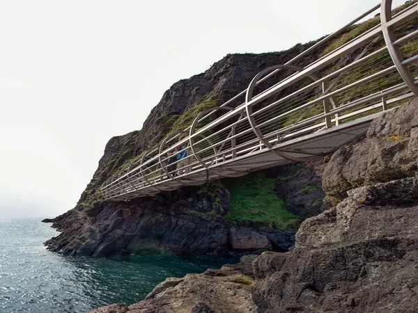 A steel pathway along the coast's edge in Antrim, Ireland.